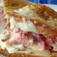 Turkey Reuben · Oven roasted turkey with sauerkraut, russian dressing and swiss cheese on your choice of bre...