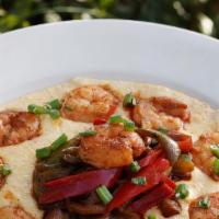 Shrimp & Grits · Large shrimp sautéed with sauce picante, served over a pimento cheese grits with sauce pican...