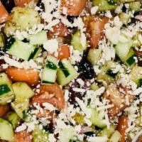 C1-Village Greek Salad (Horiatiki) · Chopped tomatoes, cucumbers, onions and feta cheese, tossed with extra virgin olive oil vine...