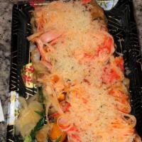 Fuji Mountain Roll · Crabmeat, avocado, and cream cheese light fried topped with baked spicy crab meat served wit...