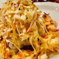 Volcano · Crabmeat, cucumber, avocado, and cream cheese topped with bake spicy crab salad, whitefish, ...