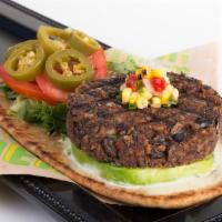 Black Bean Burger (Vegetarian) · Black Beans, Rice, Avocado, House Pickled Jalepenos, Baby Greens, Tomatoes, Corn Relish, Hor...