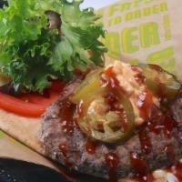 Butcher Blend Burger · Jalapeño Pimento Cheese, BBQ Sauce, Tomatoes, Baby Greens, Bacon Aioli