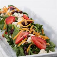 Spinach Salad ** · Spinach, Seasonal Fruit, Strawberries, Toasted Almonds, Blue Cheese Crumbles, Dried Cranberr...