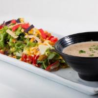 1/2 Southwest Salad** · Mixed Greens, Tomatoes, Cheese, Fresh Roasted Corn, Dried Cranberries, Golden Raisins, Torti...