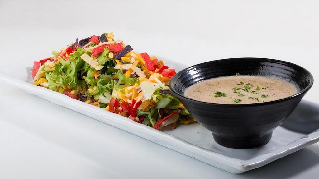 1/2 Southwest Salad** · Mixed Greens, Tomatoes, Cheese, Fresh Roasted Corn, Dried Cranberries, Golden Raisins, Tortilla Crisps.. Recommended Dressing: Southwest Ranch