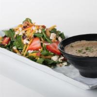 1/2 Spinach Salad** · Spinach, Seasonal Fruit, Strawberries, Toasted Almonds, Blue Cheese Crumbles, Dried Cranberr...