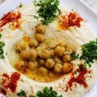 Hummus · Freshly puréed chickpeas with tahini, garlic, lemon juice and olive oil.