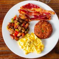 Jaz'S Special · Salmon croquette, bacon or sausage, pancake, cheesy scrambled eggs & hash browns.