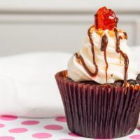Hot Fudge Sundae · Our chocolate cake filled with fudge and topped with our buttercream, and garnished with fud...