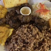 Carne Asada Nica · Marinated grilled steak strips served with your choice of rice, coleslaw, fried cheese, and ...