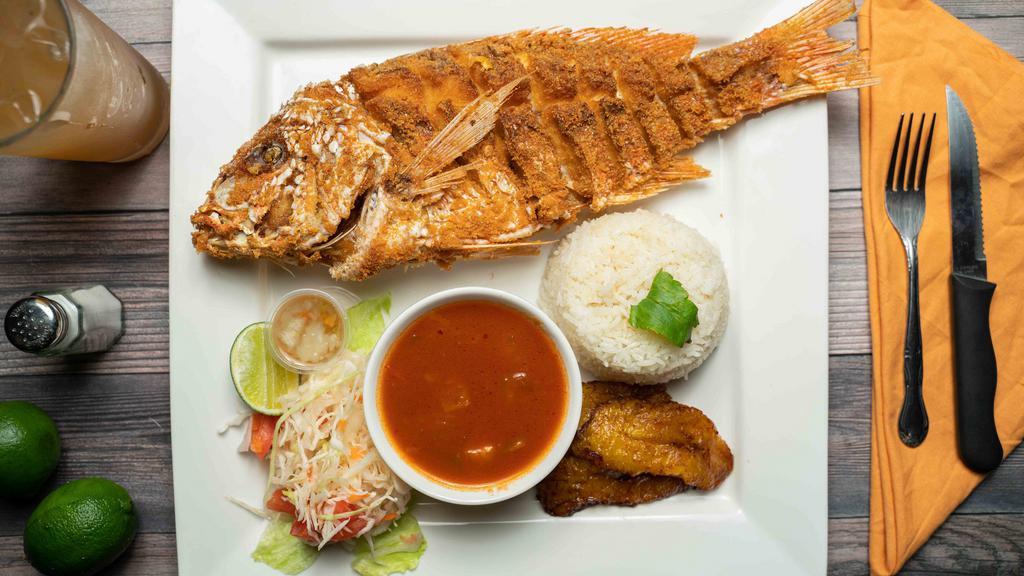 Pescado Frito · Fried Snapper served a homemade tomato sauce,  your choice of rice, coleslaw, and one side.