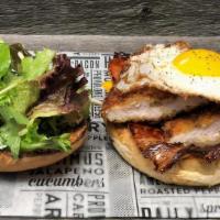 Driving Miss Sunny · toasted kaiser roll, breaded chicken, sweet ham, sunny up egg, cheddar, spring greens