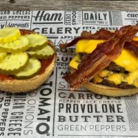 Classic Cheeseburger · toasted sesame brioche bun, two 5oz burger patties, american cheese, applesmoked bacon, ketc...