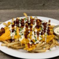 Baked Potato Fries · classic fries, melted cheddar, crumbled bacon, chives, ranch