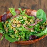 Jungle Salad · Chickpeas, onions, cilantro, jalapeño marinated on lime and garlic on a bed of spinach.