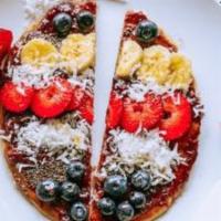 Toasting Delight · Almond butter, jam, shredded coconut on toast topped with chia seeds, local fruit, and local...