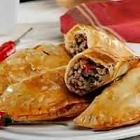 Carne Asada Empanada · Chopped steak with peppers and onions.