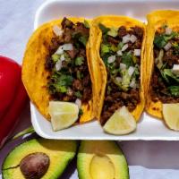 Steak · Served with onions and cilantro on corn or flour tortillas.