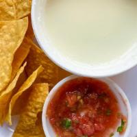 Queso Dip · A white cheese dip served warm with or without jalapenos.