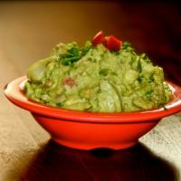Guacamole Dip · Fresh, ripe avocados, cilantro, tomatoes, onions and a touch of lime.