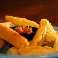 Yuca Plate · Fresh cut yuca served with our special garlic and tomato sauce.