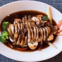 Honey Duck · Half-duck on a bed of vegetables served with a house-made honey sauce. Served with jasmine r...