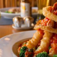 Volcano Shrimp · Colossal tempura shrimp on a bed of broccoli, covered with a house-made chili sauce. Served ...