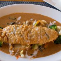Choo Chee Fish · Golden fried Asian sea bass served covered with a thick red curry. Served with mixed vegetab...