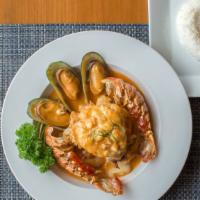 Seafood Paradise · Lobster tail, scallop, squid, mussels, shrimp, and pineapple, in a house-made
pineapple curr...