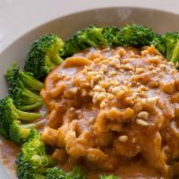 Pra Raam Curry · Bowl of broccoli filled with a thick house-made peanut sauce.