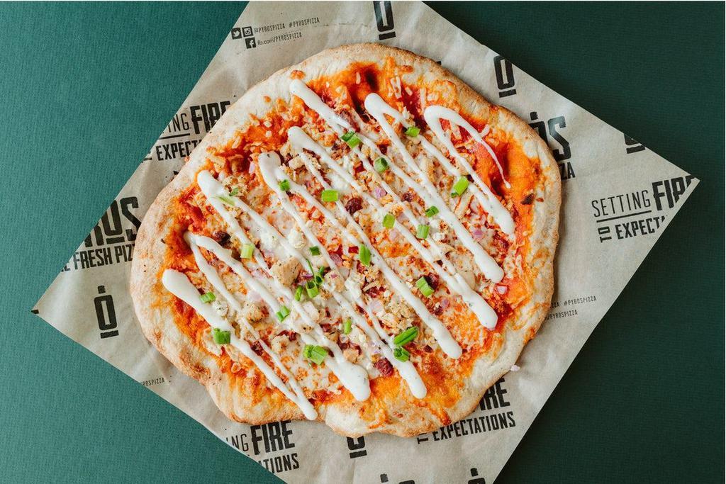Buffalo Chicken Pizza · Frank's buffalo sauce base topped with roasted chicken, mozzarella cheese, bacon, onion and Gorgonzola cheese; finished with ranch and green onions.
