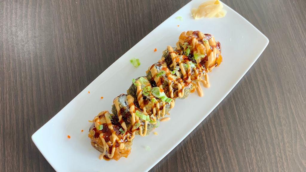 Godzilla Roll · Spicy tuna, kani and avocado deep fried and topped with eel sauce.