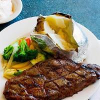 Large Cut New York Strip · Served with mixed vegetables and mashed potatoes and gravy.