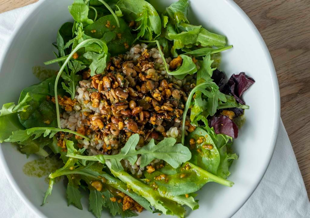Turtle Bowl · Pumpkin Seed Pesto, arugula, cilantro oil, and spiced walnuts.  Pictured here as Rice & Greens.
