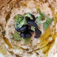 Baba Ghanouj · Grilled eggplant purée and mixed with tahini and lemon juice ~ served with pita bread