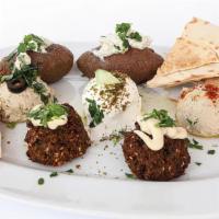Mezze Platter · A medley of our most popular appetizers, to titillate your tastebuds before enjoying your me...