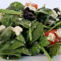 Greek Salad · A delicious traditional Greek salad with Spinach, cucumbers, tomatoes, red onions, olives, a...