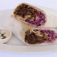 Beef Shawarma · Roasted thin slices of marinated prime beef with pickled vegetables, wrapped in a warm pita ...