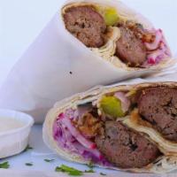 Lamb Kofta Kebah Pita · Ground lamb, parsley, picked vegetables, and spices wrapped in warm pita ~ served with fresh...