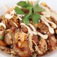 Shrimp Rice Bowl · Shrimp, Basmati Rice with Foul Moudamas, tomatoes and fresh herbs, topped with fried onions.