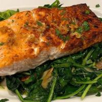 Grilled Salmon · Grilled Salmon with a lemon garlic sauce, served on top of Sautee Spinach & slivered garlic....