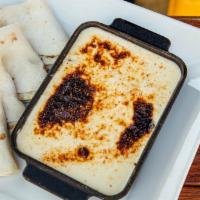 Queso Fundido · With roasted poblano 