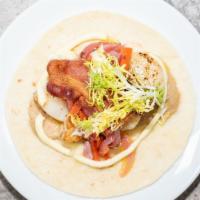 Seared Scallop Taco · Cauliflower refritos, lime aioli, applewood bacon, vegetable escabeche, baby frisee.
Consumi...