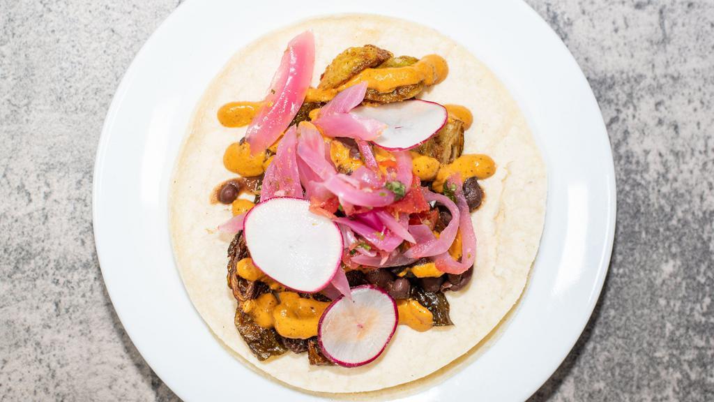 Vegan Taco · Chef's selection of locally sourced vegan ingredients. Ask your server.