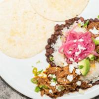 Cochinita Pibil · Traditional slow-roasted pulled pork | black beans, jasmine rice, achiote pulled pork, sweet...