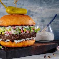 Athenian Burger · Certified Angus Beef* - Romaine Lettuce - Tomatoes - Red Onions - Tzatziki - Feta