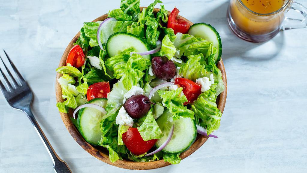 Side Salad · Crisp Romaine Hearts, Fresh Tomatoes, Cucumbers, Red Onions, Kalamata Olives, Feta and Greek Dressing.