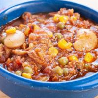 Bowl Of Brunswick Stew · A traditional hearty stew with Whole hog along with potatoes, tomatoes, beans, and corn.
