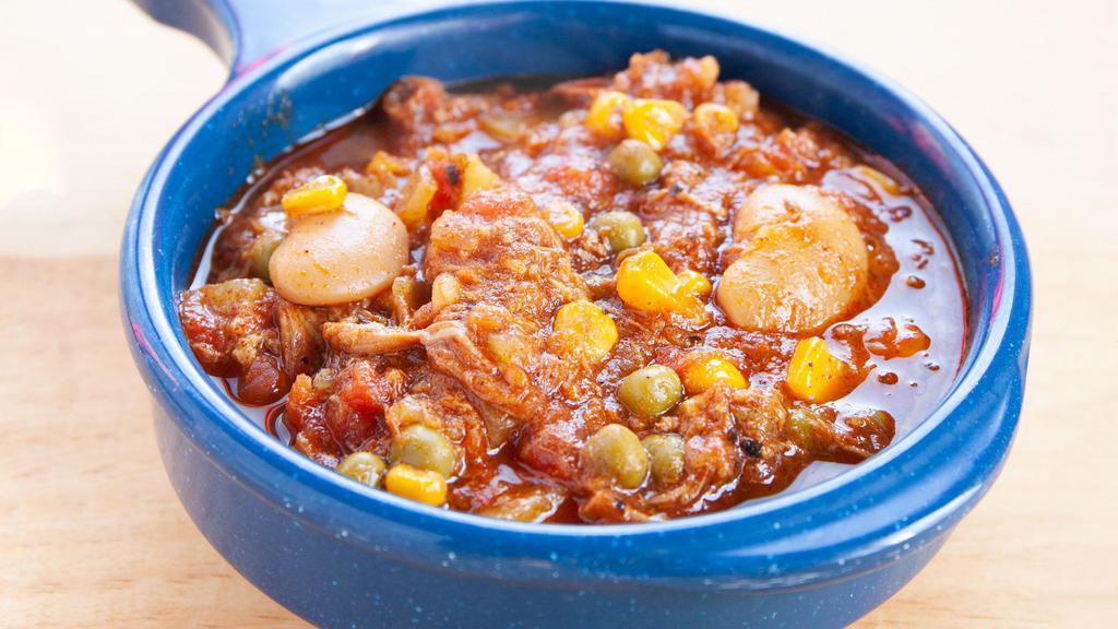 Bowl Of Brunswick Stew · A traditional hearty stew with Whole hog along with potatoes, tomatoes, beans, and corn.